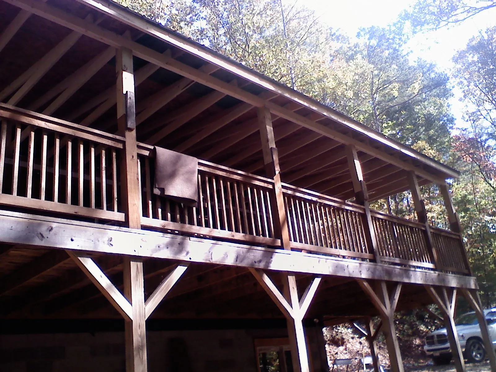 Timber framing under a new elevated porch and deck — Roof Leak Repair in Conley by Roofing Brothers